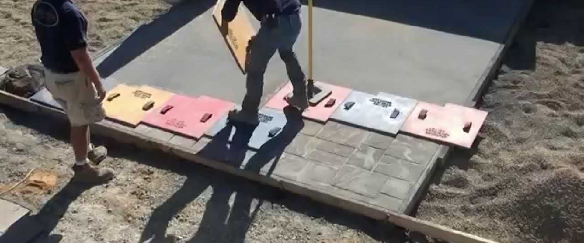 Applying Stamps to Stamped Concrete Installation Process